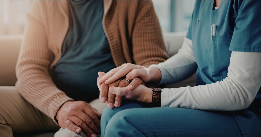 Caring hands, nurse holding patient's hand